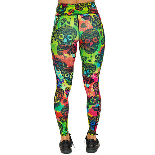 back view of full length colorful tie dye leggings with black skull pattern