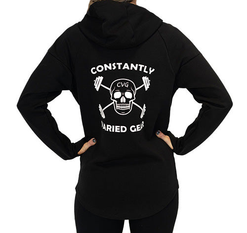 Photo of the back of a model wearing a black zip up sweatshirt with a large CVG skull logo in the middle