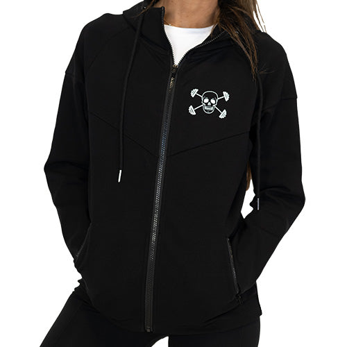 Photo of a model wearing a black zip up sweatshirt with the CVG skull logo on the top left corner