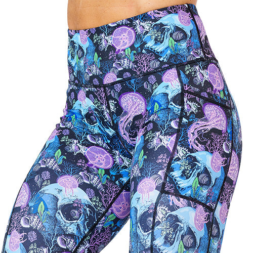 close up of purple jelly fish and blue skull print leggings