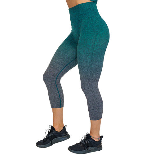 Photo of teal ombre capri length leggings. These are teal at the top and fade to grey at the bottom of the legs.