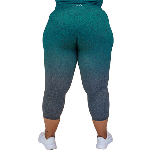 Photo of the back of the teal ombre capri length leggings. These are teal at the top and fade to grey at the bottom of the legs.