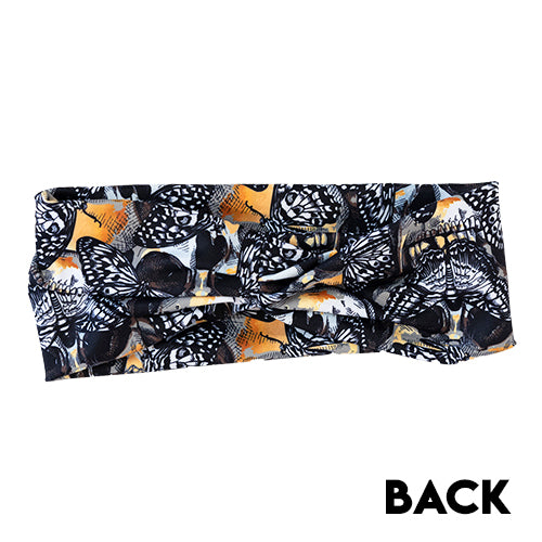 back view of headband with black and yellow skull and butterfly design