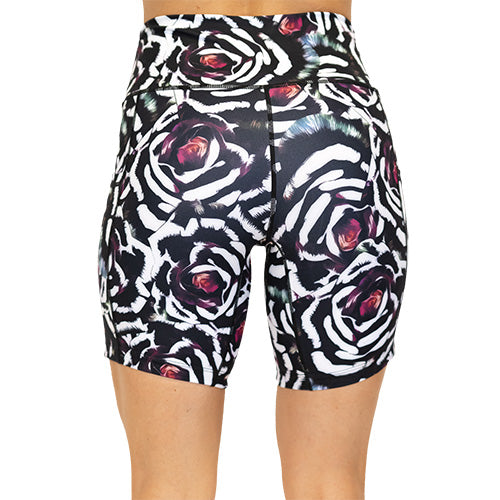 back view of blue, pink, white petal design on black 7" shorts