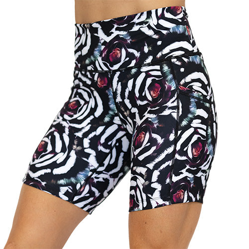 front view of blue, pink, white petal design on black 7" shorts