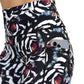close up pocket view of blue, pink, white petal design on black 7" shorts