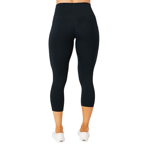 Photo of the back of the black tear it up capri length leggings. These have rips in the front of the leggings.