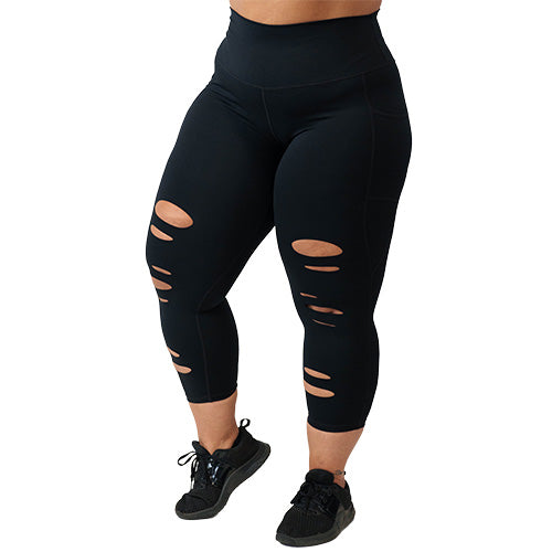 Photo of the black tear it up capri length leggings. These have rips in the front of the leggings.