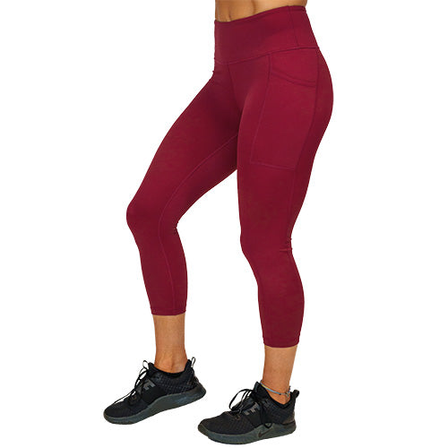 side view of capri length solid maroon leggings 