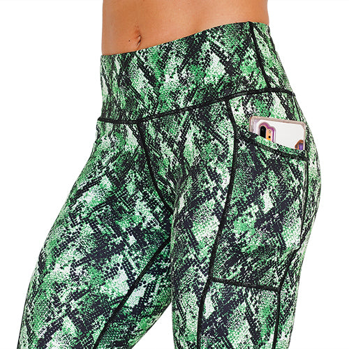 close up of side pocket on green snake skin print leggings that is large enough to hold a cell phone 