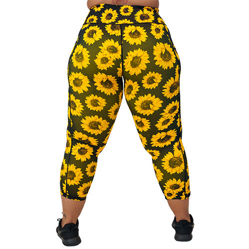 back view of capri length sunflower print leggings