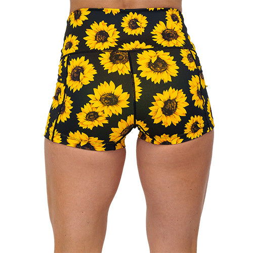 back view of the yellow flower pattern on 2.5 inch shorts against a white background