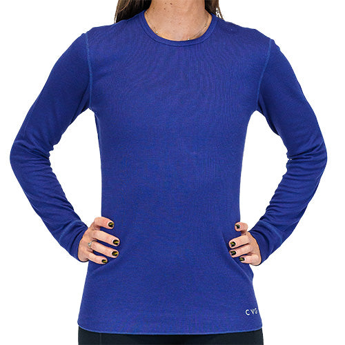 Photo of a model wearing a navy long sleeve thermal. The CVG logo is in the bottom left corner of the thermal.