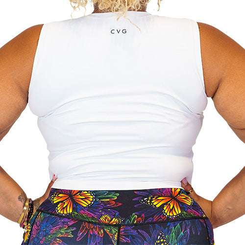Close up photo of the back of a model wearing a white fitted crop top