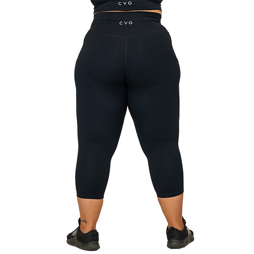 back view of capri length solid black leggings