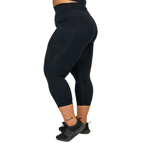 side view of capri length solid black leggings