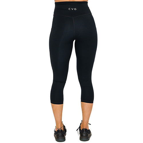 back view of capri length solid black leggings