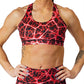 front view of black with red lightning bolt design sports bra