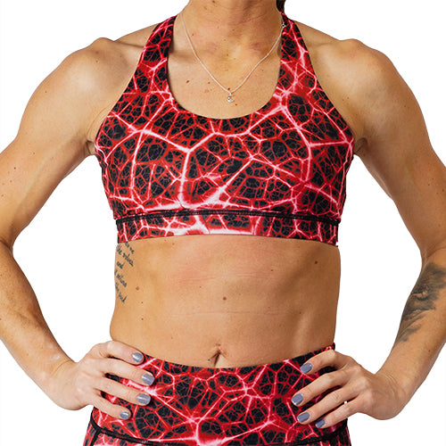 front view of black with red lightning bolt design sports bra