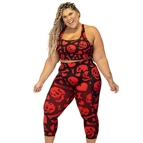 red and black leggings and bra with skulls, bones and hearts