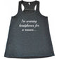 grey racerback tank top with the saying "I'm wearing headphones for a reason..."