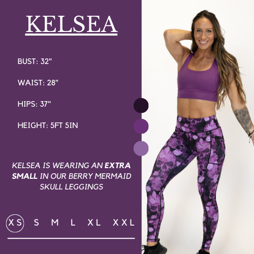 Model wearing mermaid skull leggings and berry longline bra and her measurements of 32 inch bust, 28 inch waist, 37 inch hips, and height of 5 foot 5 inches. She is wearing a size extra small in the mermaid skull leggings.