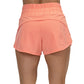 back view of solid pink peach colored running shorts