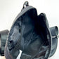 close up of the inside of the solid black belt bag 