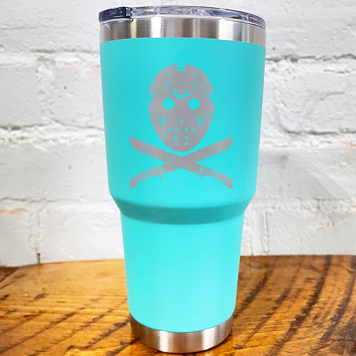 30oz teal blue tumbler with silver slasher face and criss cross knives below it