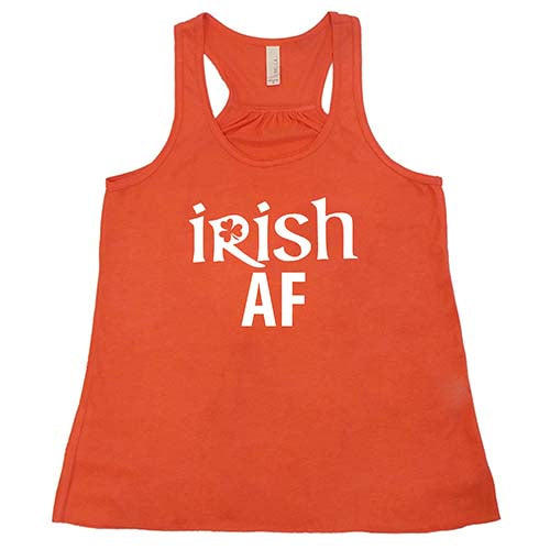 coral racerback tank top with the quote "Irish AF" in white
