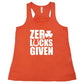 coral racerback tank top with the quote "zero lucks given" in white
