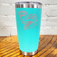 20oz teal blue tumbler with silver dino skull with speech bubble saying "rawr!"