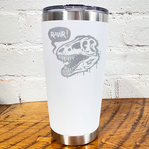 20oz white tumbler with silver dino skull with speech bubble saying "rawr!"