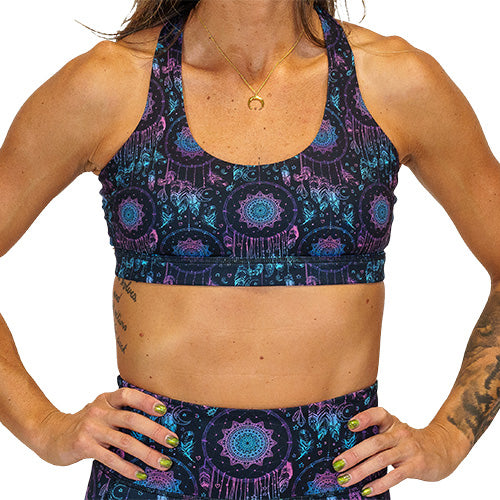 front view of pink, purple and blue dream catcher print sports bra