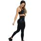 model wearing full length faux leather leggings and matching sports bra