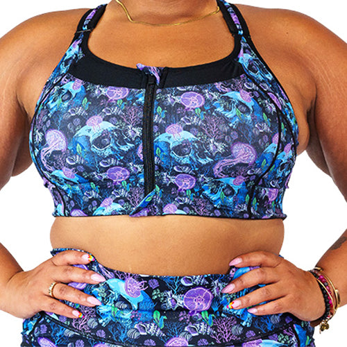 front view of blue and purple skull and jelly fish print front zipper sports bra