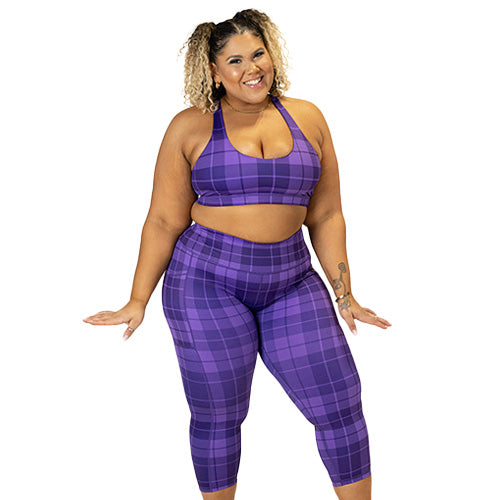 model wearing purple plaid capri leggings and butterfly back bra