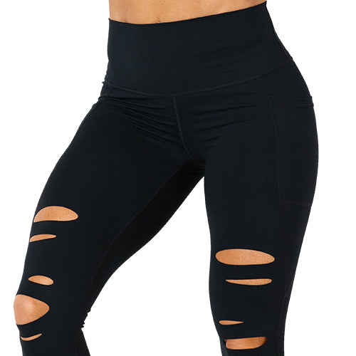 Close up photo of the black tear it up leggings. These have rips in the leggings 