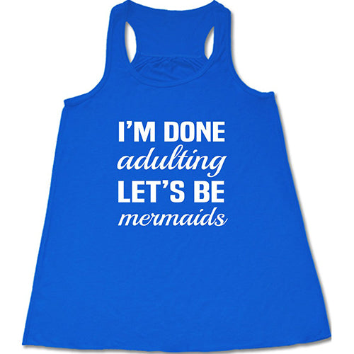 Blue racerback tank with the saying "I'm done adulting lets be mermaids" in white