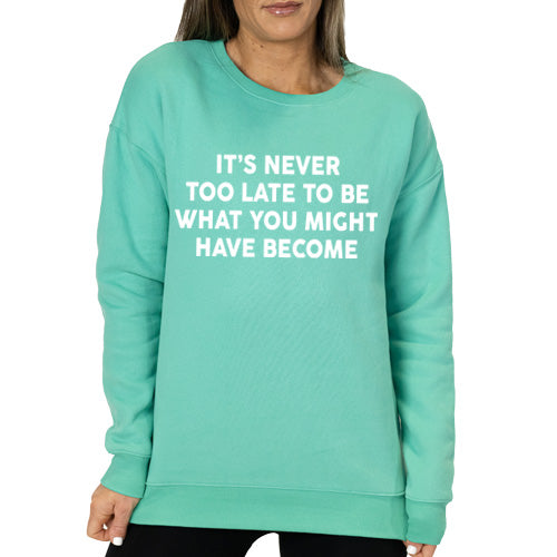 Spearmint colored crew neck with the saying "it's never too late to be what you might have become"