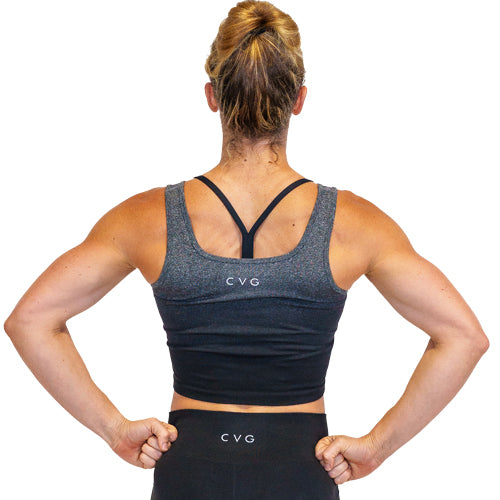 Photo of the back of a model wearing a black ombre crop top with the CVG logo at the top