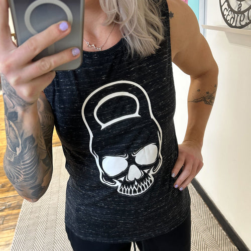 model wearing a black marble muscle tank with a kettlebell skull design on the front