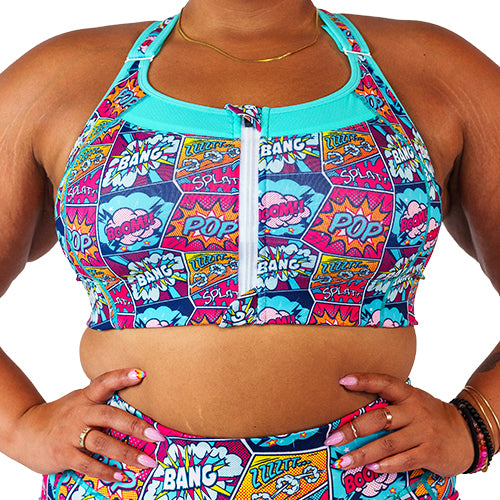 front view of front zipper comic book inspired print sports bra