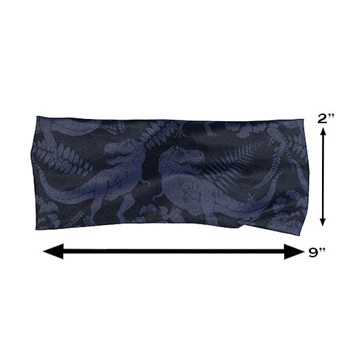 black and grey dinosaur patterned headband measured  at 2 by 9 inches