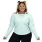 front view of the mint green long sleeve shirt off the shoulders of the model