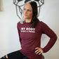 front view of heather cardinal colored long sleeve shirt with saying in the color white