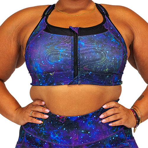 front view of purple galaxy print front zipper sports bra