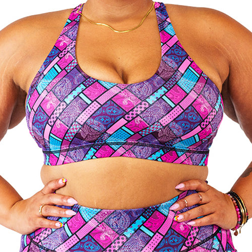 front view of pink, blue and purple paisley sports bra