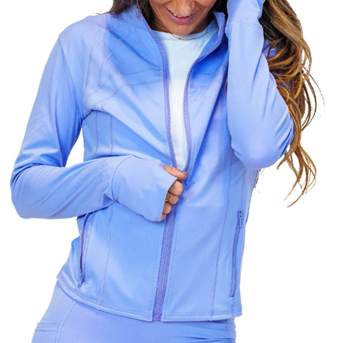 Photo of a model wearing a periwinkle zip up track jacket.