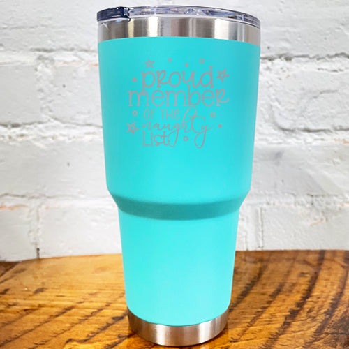30oz teal blue tumbler with silver saying "proud member of the naughty list"